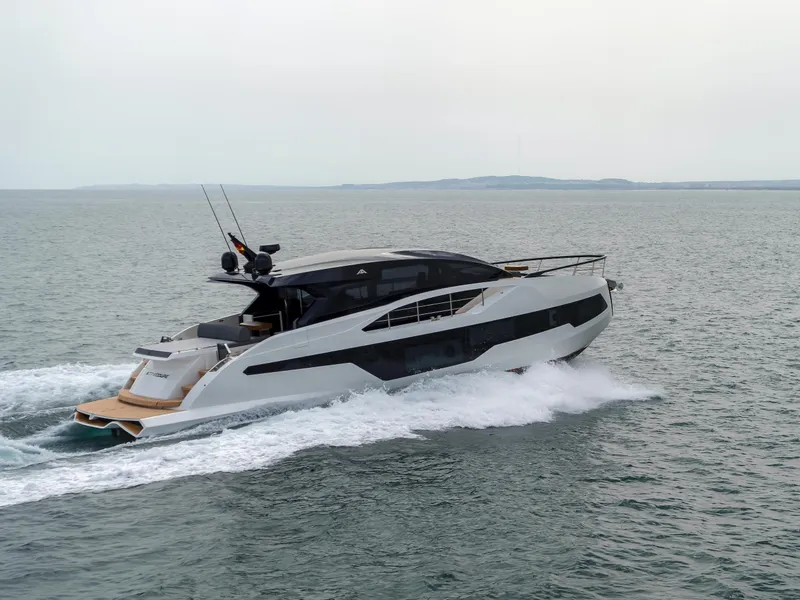 The Image of 2023 Astondoa 677 Coupe yacht cruising on open water. - 1