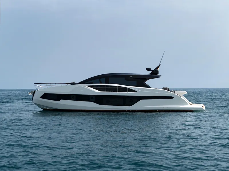 Slide: The Image of 2023 Astondoa 677 Coupe yacht on open sea, sleek modern design. - 10