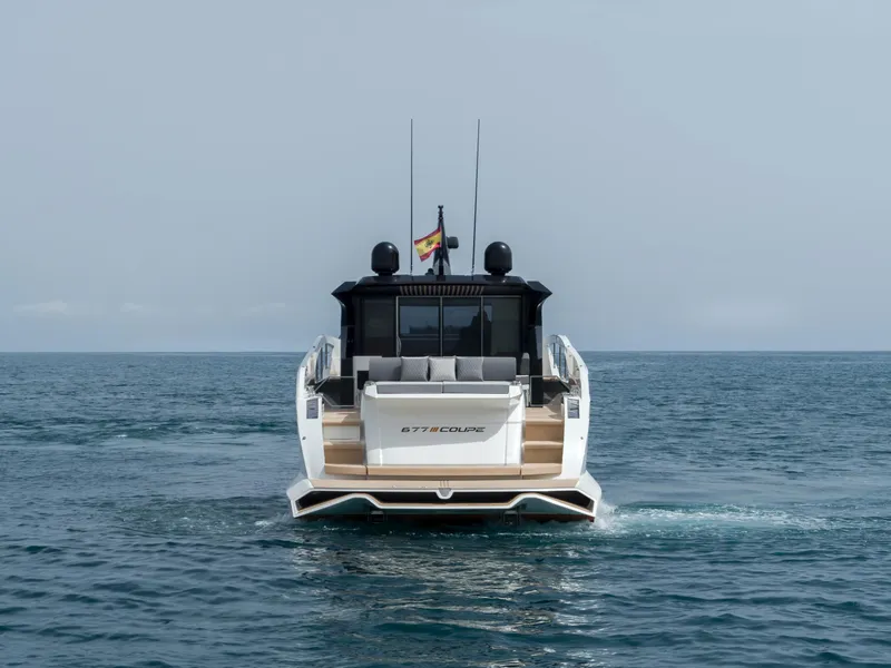 Slide: The Image of 2023 Astondoa 677 Coupe yacht cruising on open sea. - 12