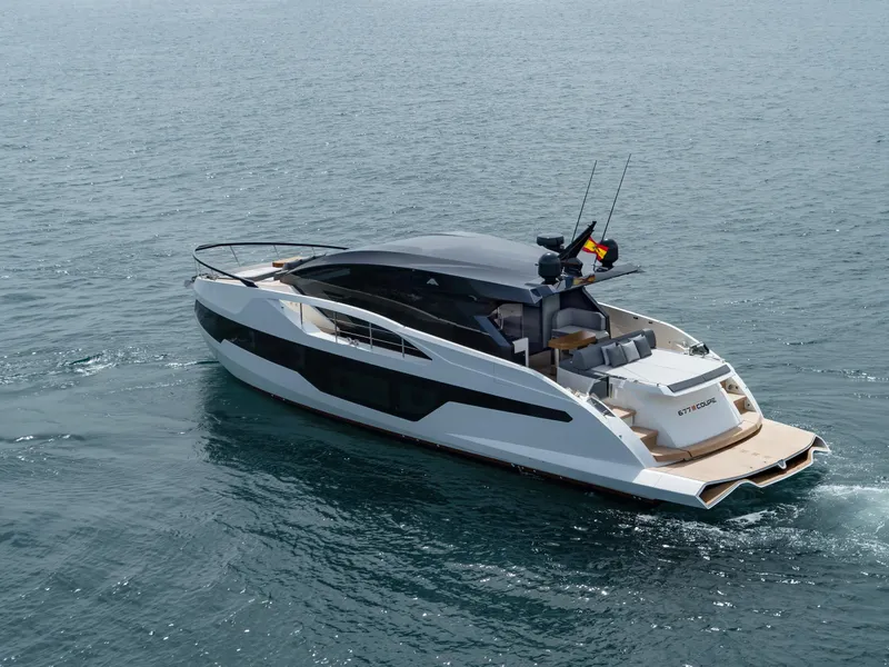 Slide: The Image of 2023 Astondoa 677 Coupe luxury yacht cruising on open water. - 13