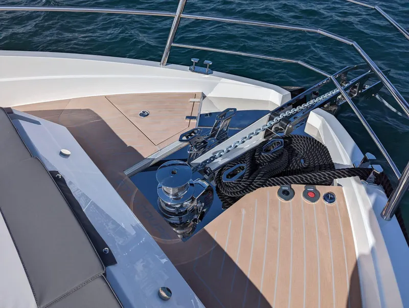 Slide: The Image of Astondoa 677 Coupe 2023 yacht deck with anchor and ropes on water. - 15
