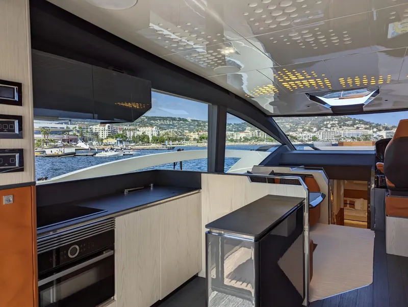 Slide: The Image of Luxurious interior of 2023 Astondoa 677 Coupe yacht with modern kitchen and scenic views. - 19