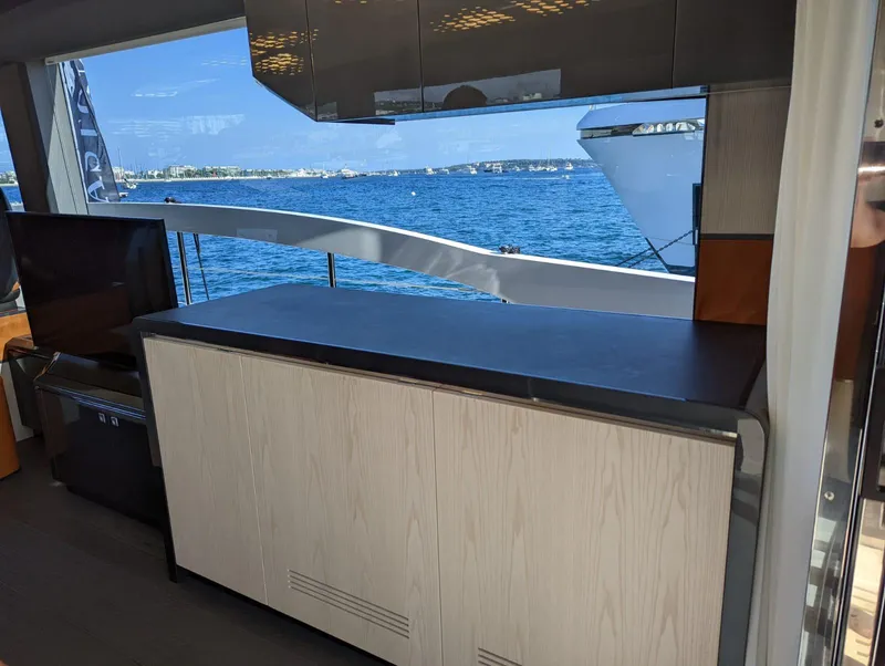 Slide: The Image of Interior view of 2023 Astondoa 677 Coupe yacht with ocean backdrop. - 21