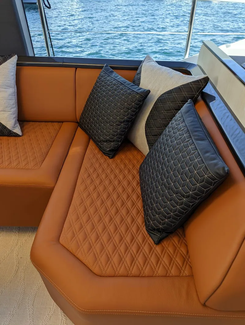 Slide: The Image of Luxurious leather seating on 2023 Astondoa 677 Coupe yacht with quilted cushions. - 23