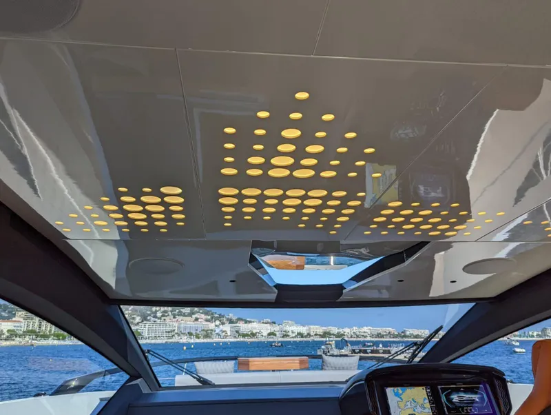 Slide: The Image of Interior view of 2023 Astondoa 677 Coupe yacht with modern ceiling design. - 25
