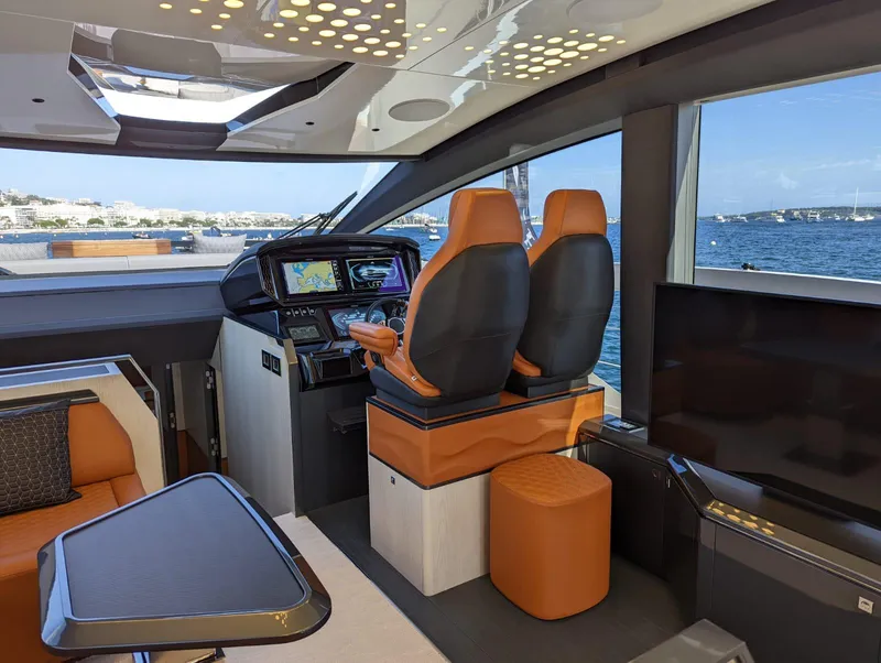 Slide: The Image of Interior of 2023 Astondoa 677 Coupe yacht with modern helm and luxurious seating. - 26