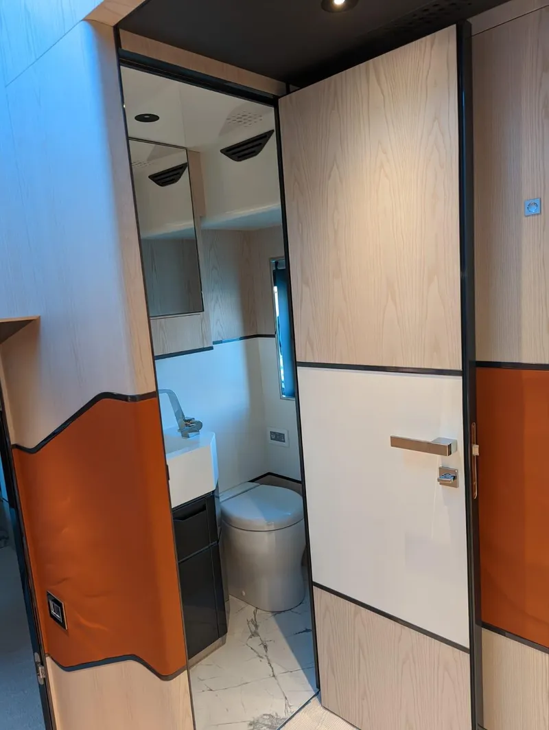 Slide: The Image of 2023 Astondoa 677 Coupe bathroom with modern design and sleek finishes. - 36
