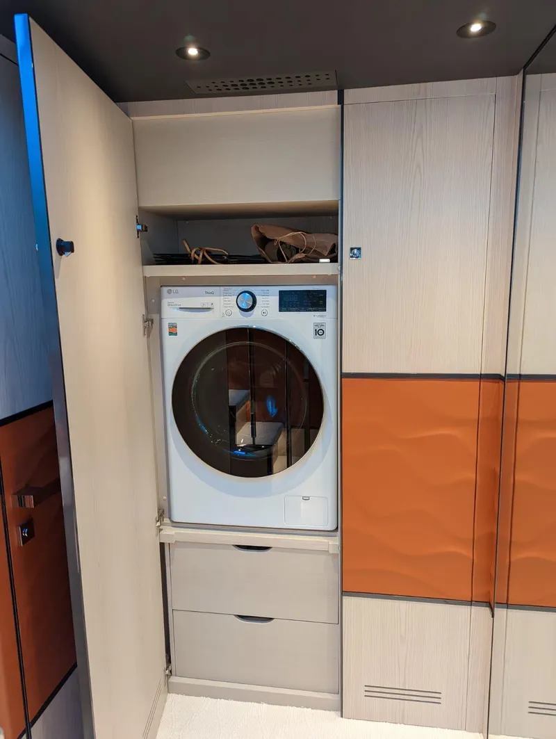 Slide: The Image of Built-in washing machine in 2023 Astondoa 677 Coupe yacht interior. - 37