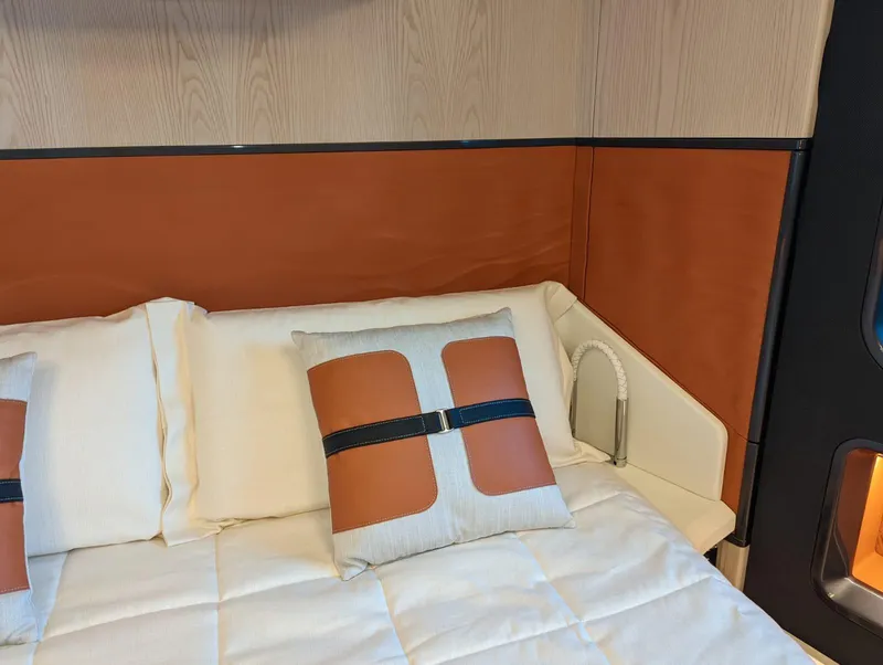 Slide: The Image of Luxurious bedroom interior of 2023 Astondoa 677 Coupe yacht with stylish pillows and bedding. - 41