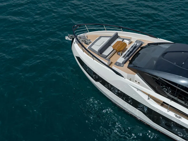 Slide: The Image of 2023 Astondoa 677 Coupe yacht on clear blue water, aerial view. - 5