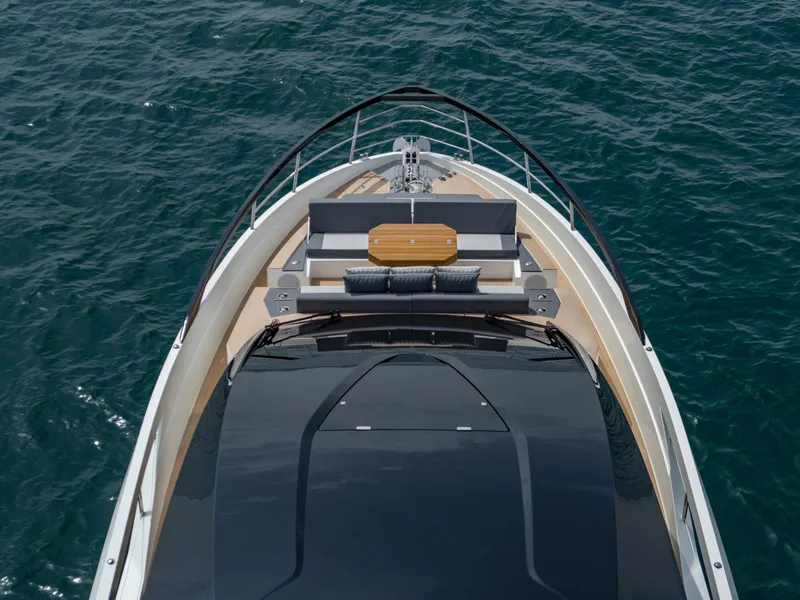 Slide: The Image of 2023 Astondoa 677 Coupe yacht, aerial view of deck and seating area on open water. - 6