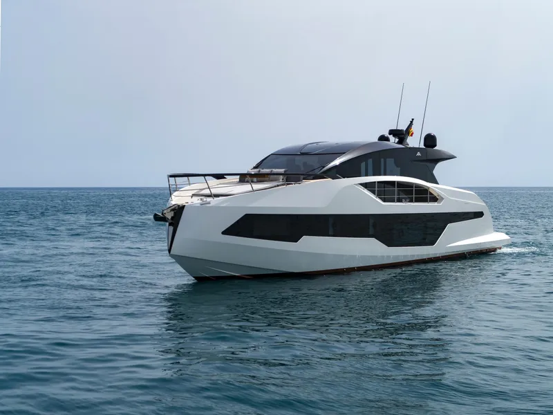 Slide: The Image of 2023 Astondoa 677 Coupe yacht cruising on open water. - 8
