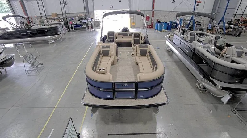 Slide: The Image of 2023 Barletta Cabrio 24UC pontoon boat in a showroom, top view. - 3