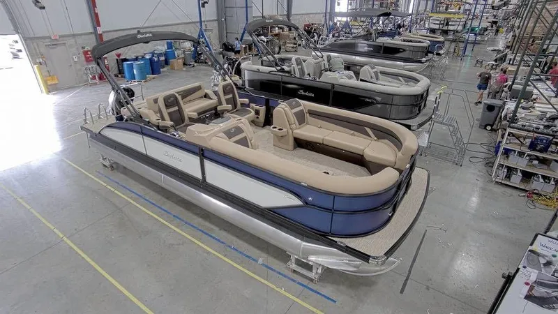 Slide: The Image of 2023 Barletta Cabrio 24UC pontoon boat in a manufacturing facility. - 4