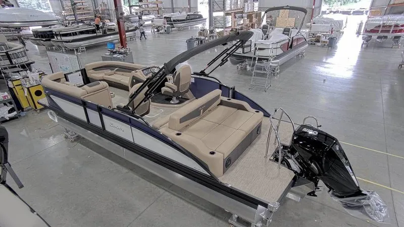 Slide: The Image of 2023 Barletta Cabrio 24UC pontoon boat in a showroom, rear view. - 5