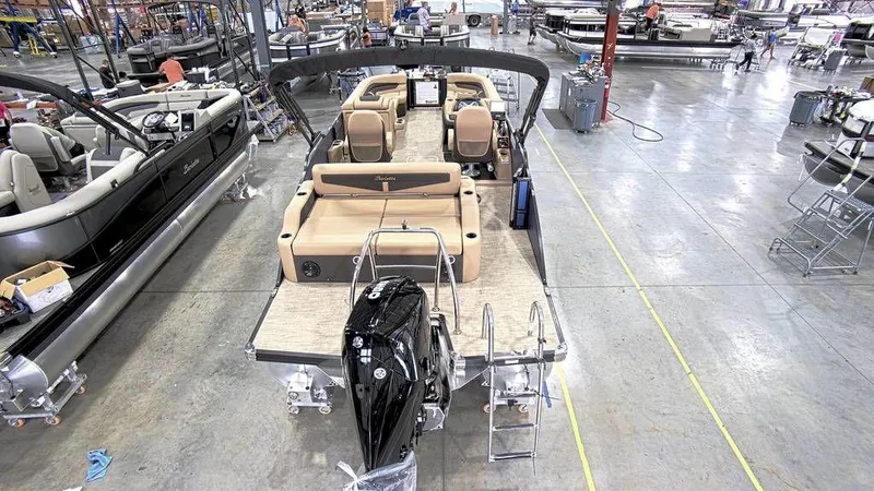 Slide: The Image of 2023 Barletta Cabrio 24UC pontoon boat in a manufacturing facility. - 6