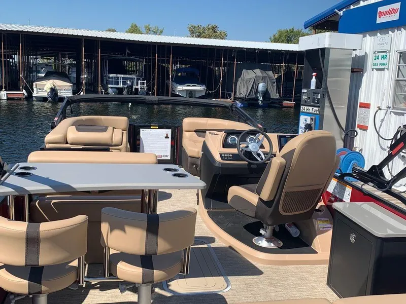 Slide: The Image of 2023 Barletta Cabrio 24UE pontoon boat interior at marina dock. - 4
