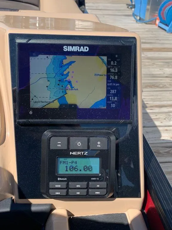 Slide: The Image of Simrad navigation system on 2023 Barletta Cabrio 24UE boat dashboard. - 6