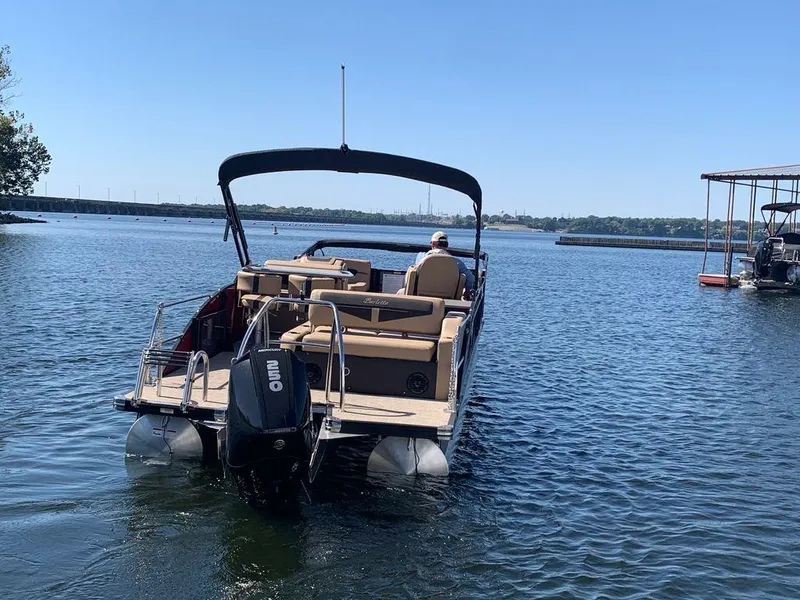 Slide: The Image of 2023 Barletta Cabrio 24UE pontoon boat on a calm lake. - 8