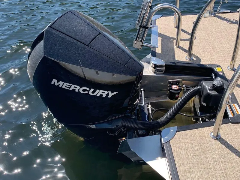Slide: The Image of 2023 Barletta Cabrio 24UE with Mercury outboard engine on water. - 9