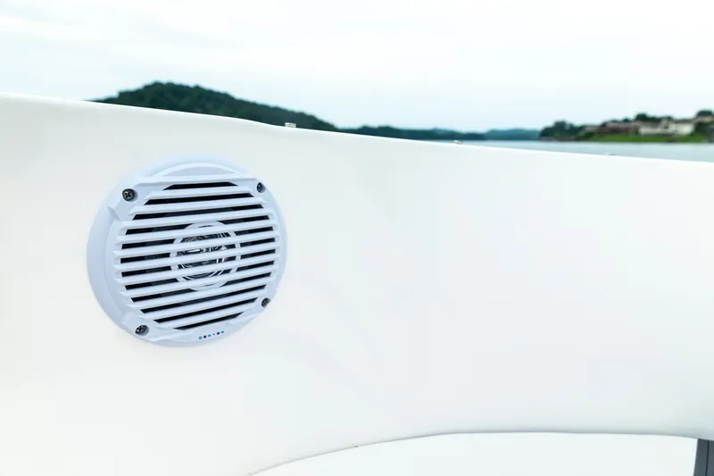 Slide: The Image of 2023 Bayliner VR4 OB boat speaker on white interior with scenic water view. - 12