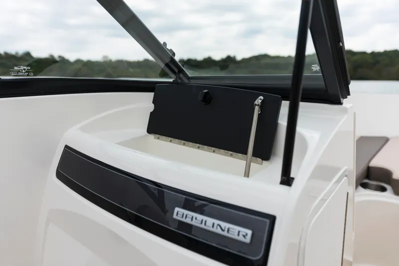Slide: The Image of 2023 Bayliner VR4 OB boat dashboard with open storage compartment. - 37
