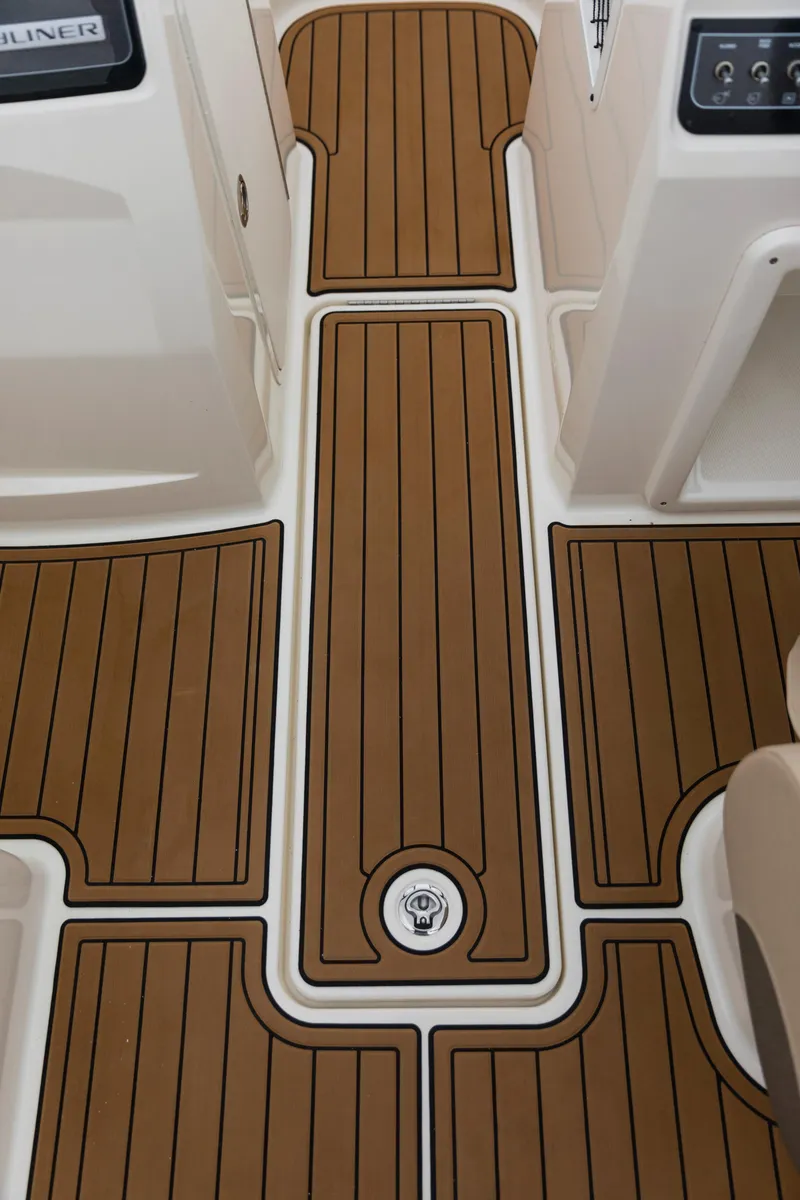 Slide: The Image of 2023 Bayliner VR4 OB boat deck with teak-style flooring. - 40