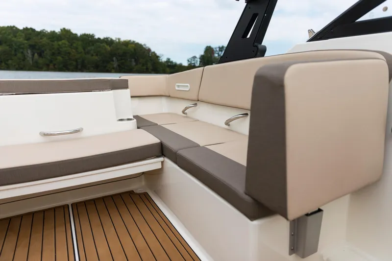 Slide: The Image of 2023 Bayliner VR4 OB boat interior with beige seating and wood-style flooring. - 46