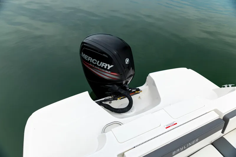 Slide: The Image of 2023 Bayliner VR4 OB boat with Mercury outboard motor on calm water. - 5