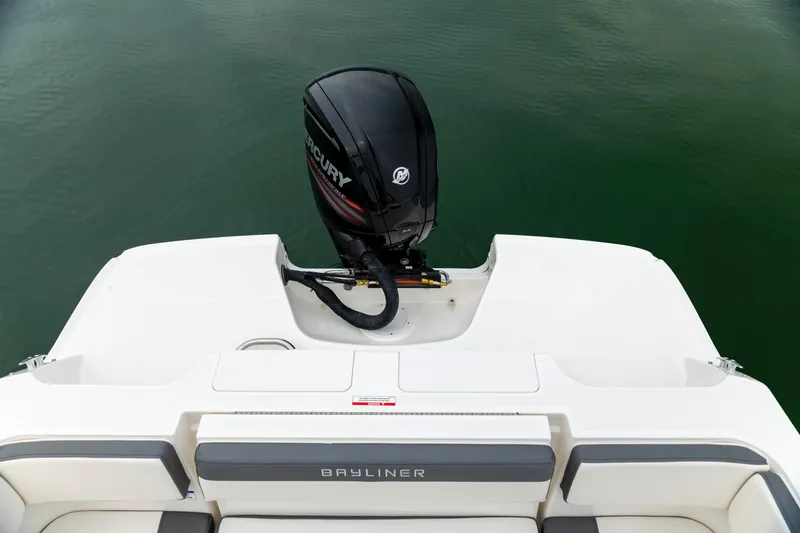 Slide: The Image of 2023 Bayliner VR4 OB boat with Mercury outboard motor on calm water. - 7