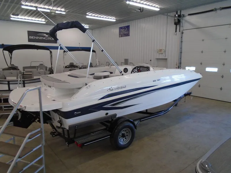 Slide: The Image of 2023 Hurricane SunDeck Sport 188 IO boat in showroom on trailer. - 14