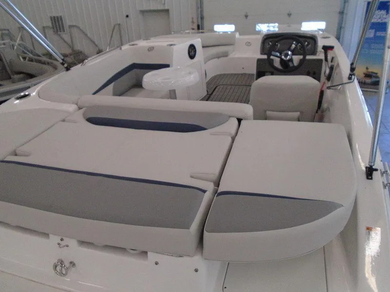Slide: The Image of 2023 Hurricane SunDeck Sport 188 IO boat interior with seating and steering wheel. - 19