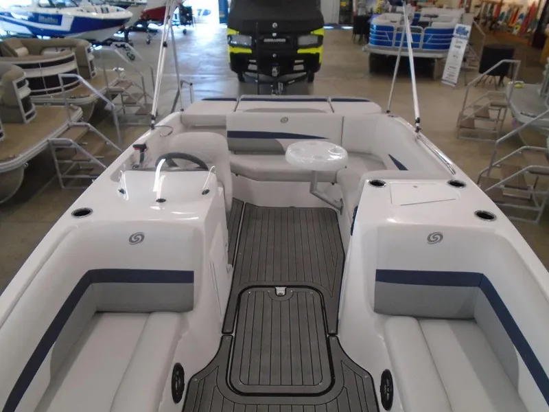 Slide: The Image of 2023 Hurricane SunDeck Sport 188 IO boat interior with seating and steering wheel. - 21