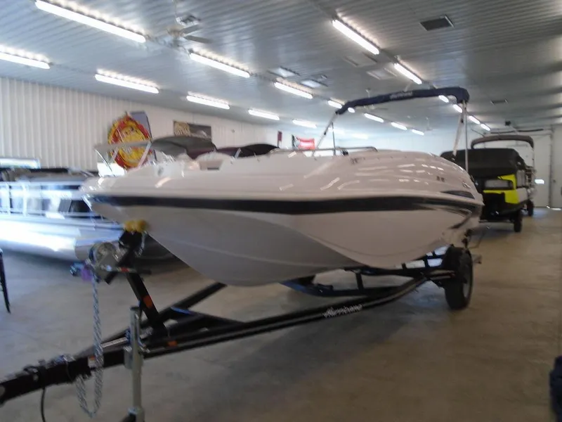 Slide: The Image of 2023 Hurricane SunDeck Sport 188 IO boat on trailer in showroom. - 23