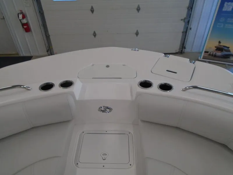 Slide: The Image of 2023 Hurricane SunDeck Sport 188 IO boat interior with cup holders and storage compartments. - 24