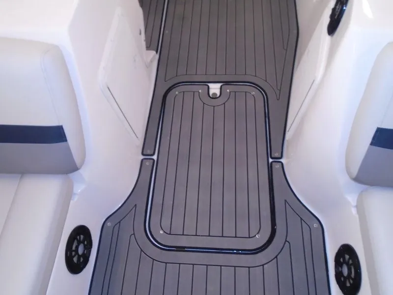 Slide: The Image of 2023 Hurricane SunDeck Sport 188 IO boat interior with gray flooring and white seating. - 4