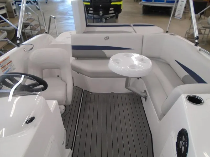 Slide: The Image of 2023 Hurricane SunDeck Sport 188 IO interior with seating and table. - 8