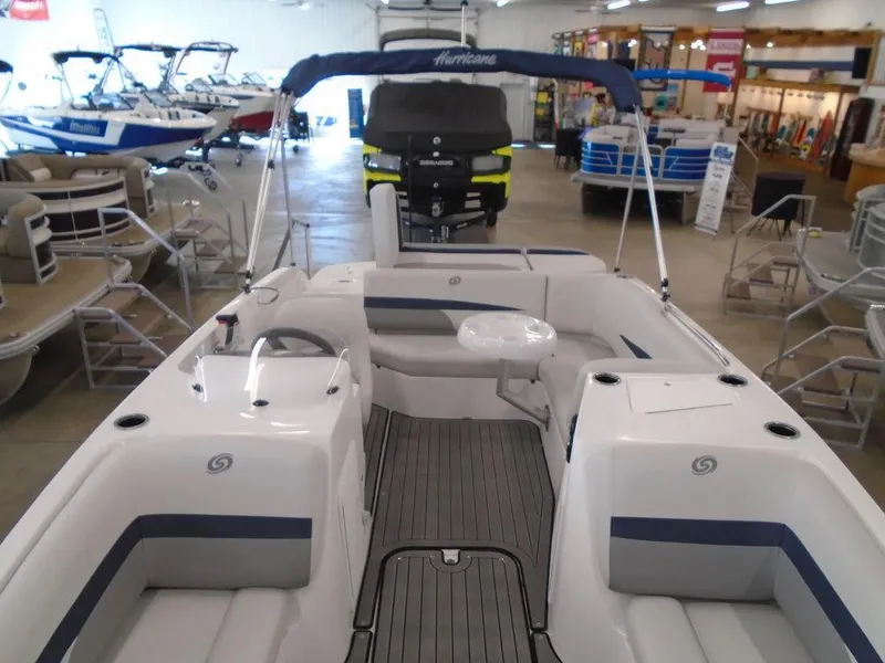 Slide: The Image of 2023 Hurricane SunDeck Sport 188 IO boat interior in showroom. - 9