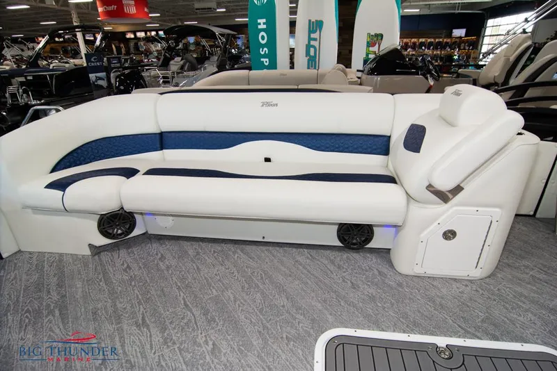 Slide: The Image of JC NEPTOON 25 TT SPORT 2022 boat interior with white and blue seating at Big Thunder Marine. - 14