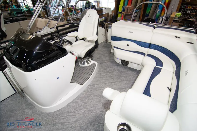 Slide: The Image of Interior of a 2022 JC NEPTOON 25 TT SPORT boat with white and blue seating. - 23