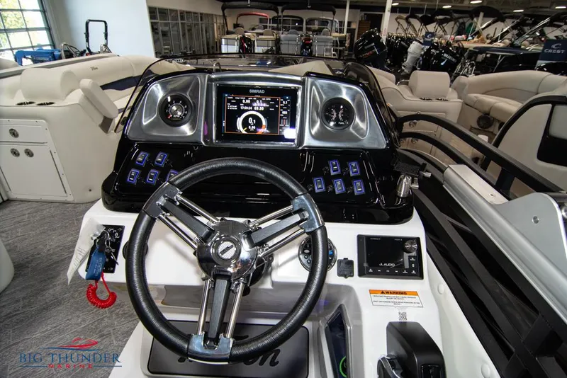 Slide: The Image of 2022 JC NEPTOON 25 TT SPORT boat dashboard with steering wheel and control panel. - 26