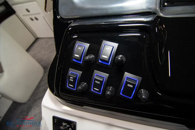 Slide: The Image of Control panel of 2022 JC NEPTOON 25 TT SPORT boat with labeled switches. - 30