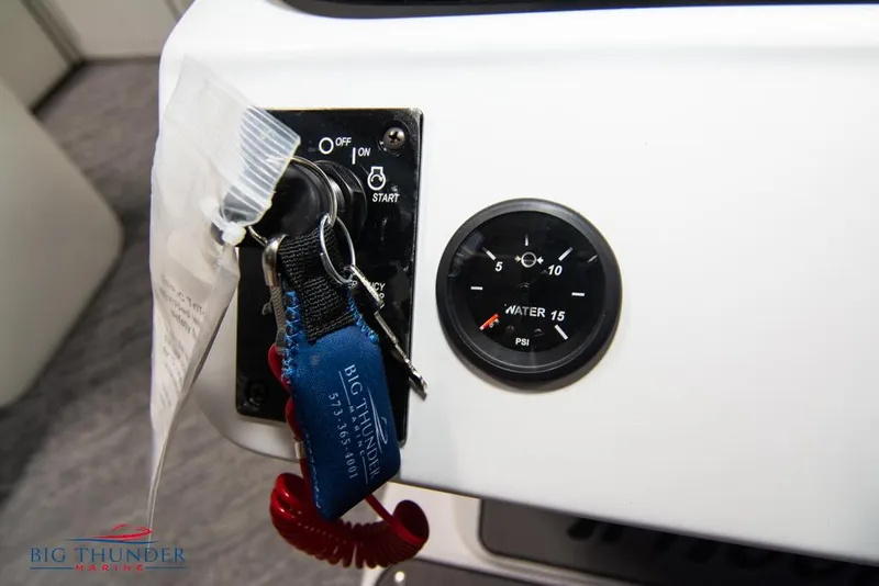 Slide: The Image of 2022 JC NEPTOON 25 TT SPORT boat ignition switch and water pressure gauge. - 32