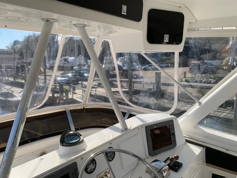 Slide: The Image of Interior view of 1997 Phoenix 38 SFX Convertible boat cockpit with navigation equipment. - 38