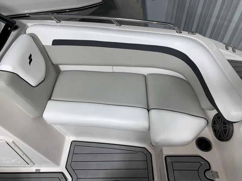Slide: The Image of 2024 Starcraft SVX 210 boat interior seating with gray and white upholstery. - 10