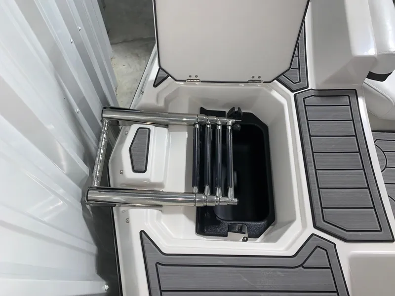 Slide: The Image of 2024 Starcraft SVX 210 boat with built-in retractable ladder. - 11