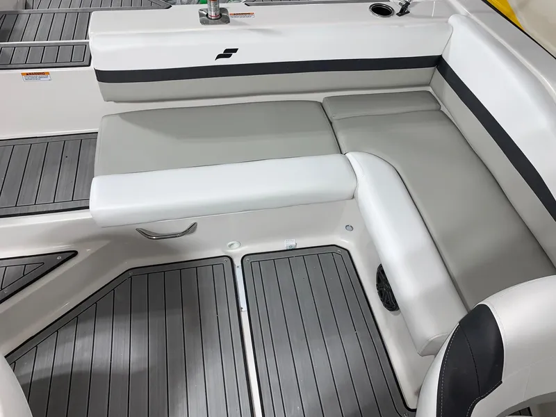 Slide: The Image of 2024 Starcraft SVX 210 boat interior with gray and white seating and flooring. - 4