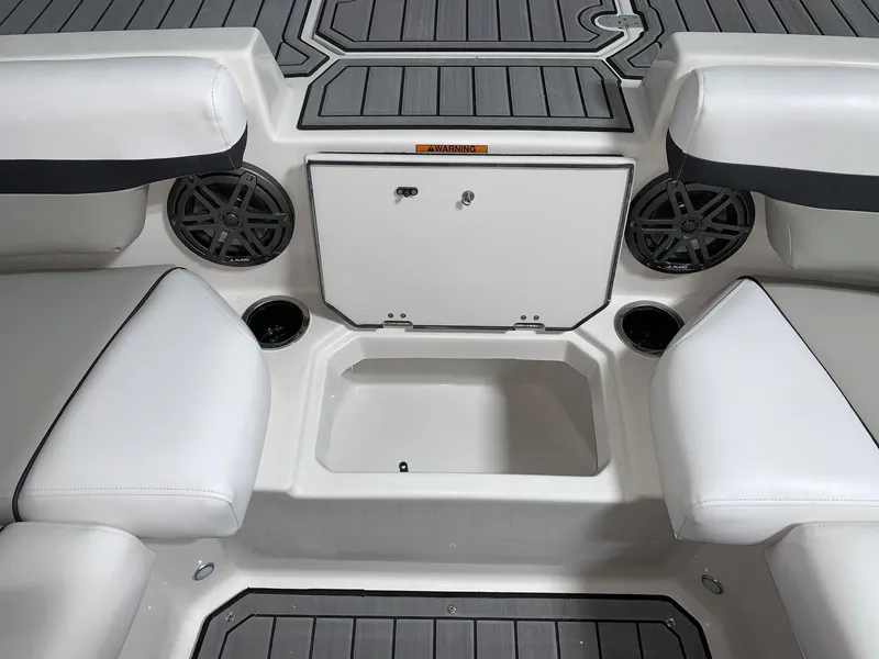 Slide: The Image of 2024 Starcraft SVX 210 boat interior with storage compartment and seating. - 8