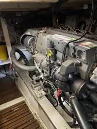 Slide: The Image of Engine room of a 1983 Grand Banks 42 Classic yacht, showcasing mechanical components. - 26