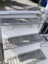 Slide: The Image of Wooden steps on a 1983 Grand Banks 42 Classic yacht deck. - 5